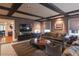 Spacious living room with hardwood floors, coffered ceiling, and comfortable seating at 450 Cherokee Dr, Orlando, FL 32801