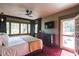 Spacious main bedroom with hardwood floors, stylish window trim, a ceiling fan, and plenty of light at 450 Cherokee Dr, Orlando, FL 32801