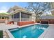 Inviting swimming pool with spacious patio and hot tub at 450 Cherokee Dr, Orlando, FL 32801