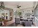 Relaxing screened porch with seating area, perfect for outdoor enjoyment at 450 Cherokee Dr, Orlando, FL 32801