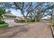 Brick-paved street lined with mature oak trees and charming homes at 450 Cherokee Dr, Orlando, FL 32801