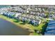 Townhomes community by the lake with various architectural styles at 564 Woodland Terrace Blvd, Orlando, FL 32828