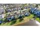 Townhomes situated along a lake, offering scenic views at 564 Woodland Terrace Blvd, Orlando, FL 32828