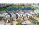 Row of townhouses with attached garages and a lake view at 564 Woodland Terrace Blvd, Orlando, FL 32828