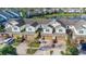Townhome community with garages, landscaping and a lake with fountain at 564 Woodland Terrace Blvd, Orlando, FL 32828