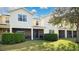 A backyard with a lawn and a covered screened in patio at 564 Woodland Terrace Blvd, Orlando, FL 32828