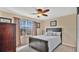 Cozy bedroom with a queen-size bed and neutral decor at 564 Woodland Terrace Blvd, Orlando, FL 32828