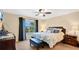 Spacious bedroom with lake view and neutral decor at 564 Woodland Terrace Blvd, Orlando, FL 32828