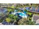 Community pool with shade structures and lounge chairs at 564 Woodland Terrace Blvd, Orlando, FL 32828