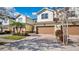 Exterior of a home with a two-car garage and a paved driveway at 564 Woodland Terrace Blvd, Orlando, FL 32828