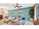 Comfortable living room with a ceiling fan, neutral-toned furniture, and a patterned rug at 564 Woodland Terrace Blvd, Orlando, FL 32828