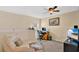 Home office with a comfortable chair and plenty of natural light at 564 Woodland Terrace Blvd, Orlando, FL 32828