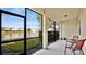 Relaxing screened patio overlooking a peaceful lake at 564 Woodland Terrace Blvd, Orlando, FL 32828