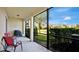 Enjoy the outdoors on this screened patio with a lake view at 564 Woodland Terrace Blvd, Orlando, FL 32828