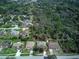 Aerial view of a home in a wooded neighborhood, marked with an arrow at 731 Red Coach Ave, Deltona, FL 32725