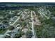 Aerial view of a home in a wooded neighborhood, marked with an arrow at 731 Red Coach Ave, Deltona, FL 32725