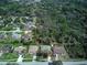 Aerial view of a neighborhood with tree coverage and well-maintained homes at 731 Red Coach Ave, Deltona, FL 32725