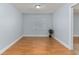 Bright bedroom featuring wood floors, a window, and a neutral color palette at 731 Red Coach Ave, Deltona, FL 32725