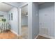 Hallway leading to a bedroom featuring neutral carpet and gray walls at 731 Red Coach Ave, Deltona, FL 32725
