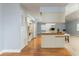 Open kitchen featuring white appliances and laminate flooring at 731 Red Coach Ave, Deltona, FL 32725