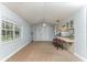 Inviting living room with a breakfast bar, a large window, and a ceiling fan at 731 Red Coach Ave, Deltona, FL 32725