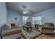 Inviting living room with neutral tones, ceiling fan, and wood flooring at 731 Red Coach Ave, Deltona, FL 32725