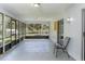 Screened patio with concrete floors and views of the lush backyard and surrounding greenery at 731 Red Coach Ave, Deltona, FL 32725