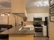 Modern kitchen with granite countertops and stainless steel appliances at 1223 Arbor Lakes Cir, Sanford, FL 32771