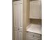 White cabinets and LG washer and dryer at 1223 Arbor Lakes Cir, Sanford, FL 32771