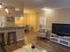 Living room with comfy seating, TV, and large windows at 1223 Arbor Lakes Cir, Sanford, FL 32771