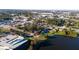 Aerial view of a single Gathering home near a lake and city skyline at 1235 19Th St, Orlando, FL 32805