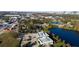 Wide aerial view displaying local neighborhood with scenic pond and city skyline, seamlessly blending nature and urban lifestyle at 1235 19Th St, Orlando, FL 32805