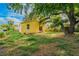 Cozy home featuring a spacious backyard with mature trees, ideal for outdoor enjoyment and relaxation at 1235 19Th St, Orlando, FL 32805