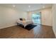 Bedroom featuring wood-look floors, recessed lighting, and sliding door to back yard at 1235 19Th St, Orlando, FL 32805