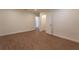 Comfortable bedroom with hardwood floors, closet, and open doorway to hall at 1235 19Th St, Orlando, FL 32805
