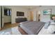 Bright bedroom featuring two beds, modern gray dresser, neutral walls, and wood flooring at 1235 19Th St, Orlando, FL 32805