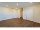 Bright bedroom with hardwood floors, closet, and access to other rooms at 1235 19Th St, Orlando, FL 32805