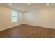 Bright bedroom features wood-look floors, recessed lighting, and a window at 1235 19Th St, Orlando, FL 32805