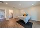 Bedroom features wood-look floors, recessed lighting and leads into bathroom at 1235 19Th St, Orlando, FL 32805