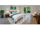 Bedroom with a white padded headboard and blue accents that opens to a sliding glass door at 1235 19Th St, Orlando, FL 32805