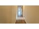 Long hallway with hardwood floors leads to other rooms in the house at 1235 19Th St, Orlando, FL 32805