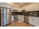 Bright kitchen features stainless steel appliances, white cabinetry, and dark granite countertops at 1235 19Th St, Orlando, FL 32805