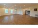 Spacious living area with hardwood floors and open concept design leading into the kitchen at 1235 19Th St, Orlando, FL 32805