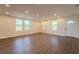 Living area with hardwood floors, recessed lighting, and natural light streaming in through the windows at 1235 19Th St, Orlando, FL 32805