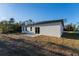 Backyard view showcases the patio, sliding glass door and private treelined perimeter at 14962 Sw 39Th Cir, Ocala, FL 34473