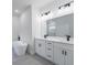 Bathroom features double sink vanity, sleek black fixtures, and a modern soaking tub at 14962 Sw 39Th Cir, Ocala, FL 34473