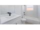 Bathroom features tile shower and flooring, modern vanity, and sleek black fixtures at 14962 Sw 39Th Cir, Ocala, FL 34473