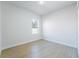 Bright bedroom features hardwood floors and a window bringing in plenty of natural light at 14962 Sw 39Th Cir, Ocala, FL 34473