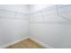 Walk-in closet features wood flooring and sturdy, adaptable wire shelving system for optimal storage at 14962 Sw 39Th Cir, Ocala, FL 34473