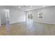 Open living space with sliding glass doors, lots of natural light, and wood-look flooring at 14962 Sw 39Th Cir, Ocala, FL 34473